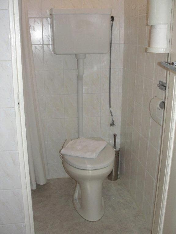 Koupelna v ubytování Staten Hotel