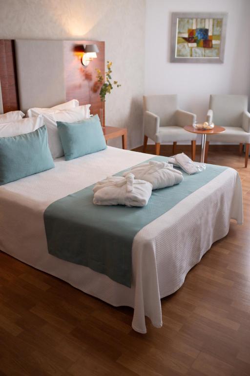 Postel nebo postele na pokoji v ubytování Hotel El Trebol