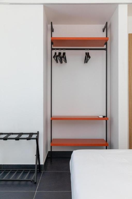 A bed or beds in a room at AMARENA B&B Porto Recanati