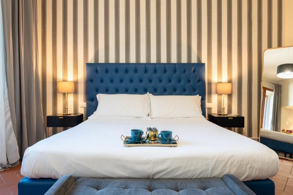 Postel nebo postele na pokoji v ubytování SPIRIT OF FLORENCE Boutique Rooms