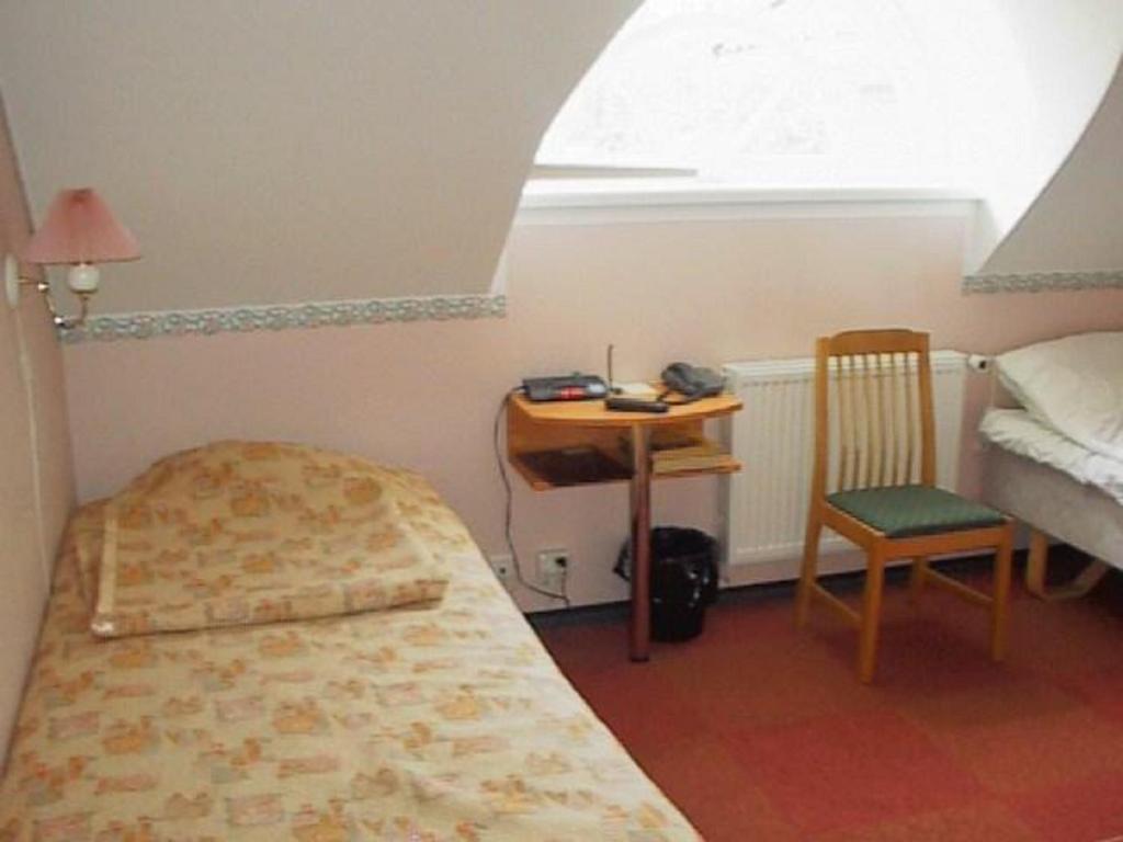 Voodi või voodid majutusasutuse Hotell De Tolly toas