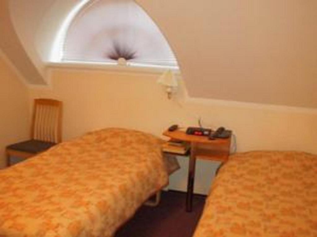 Voodi või voodid majutusasutuse Hotell De Tolly toas