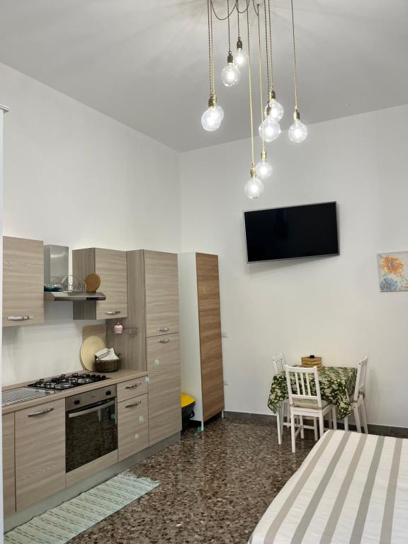 A kitchen or kitchenette at Le Dimore di "TOTIGGIA"