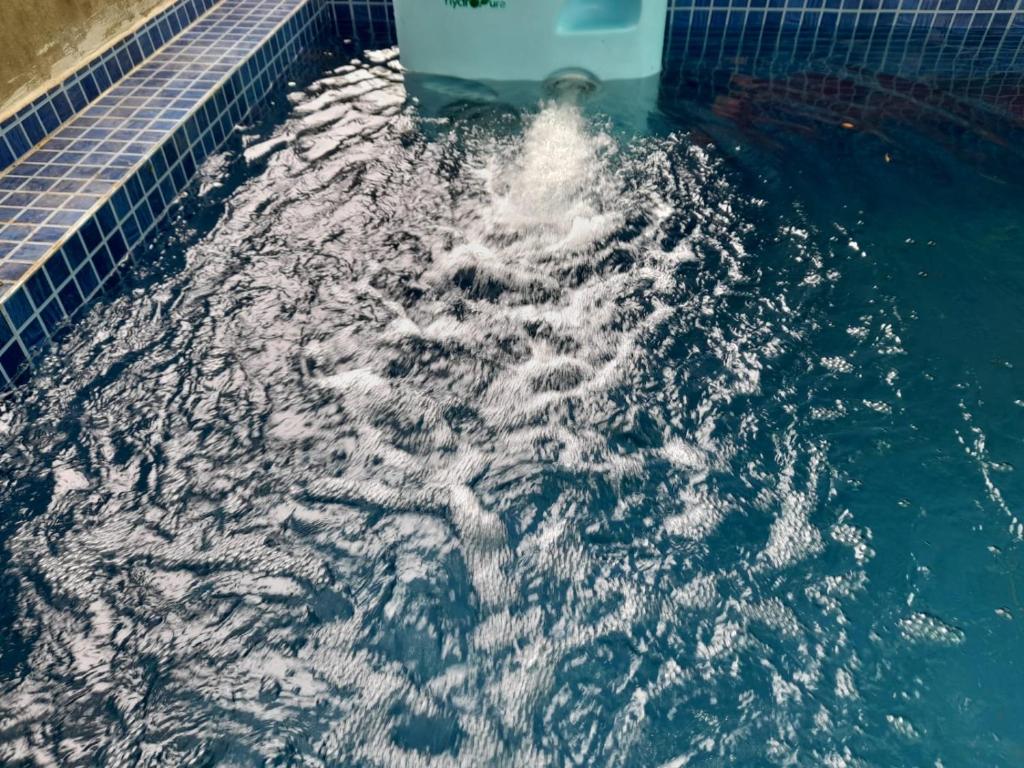 a pool of water in a swimming pool at Hotel Raaj Inn in Calangute