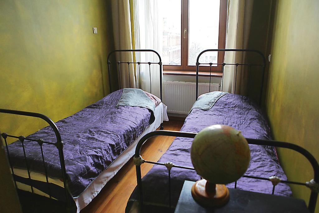 Postel nebo postele na pokoji v ubytování Angel Hostel