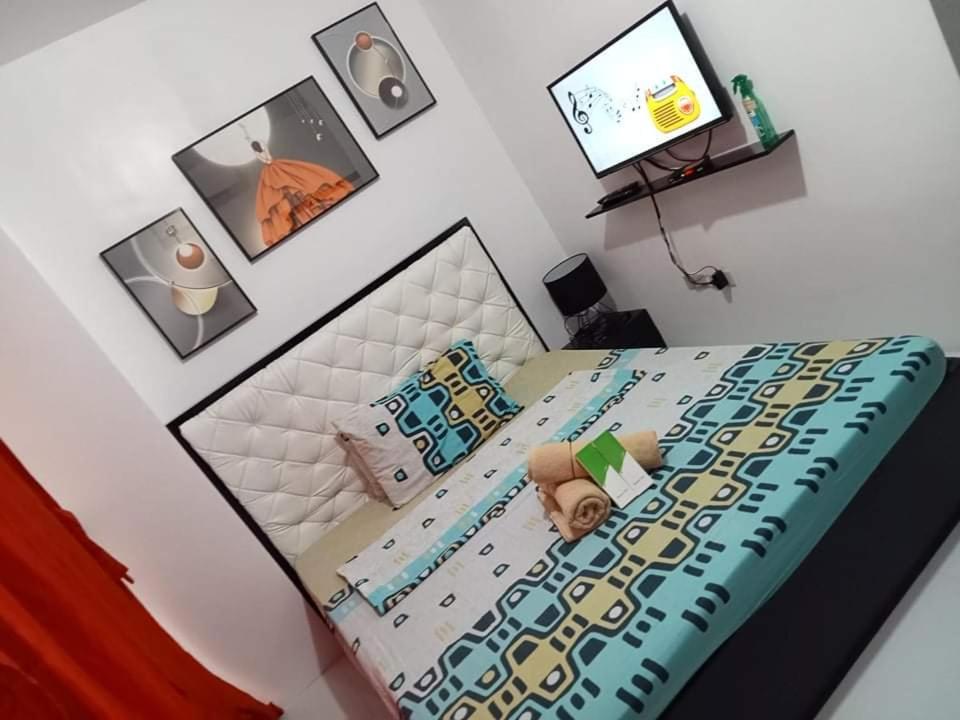 Postel nebo postele na pokoji v ubytování N&J Lopez Lodging House