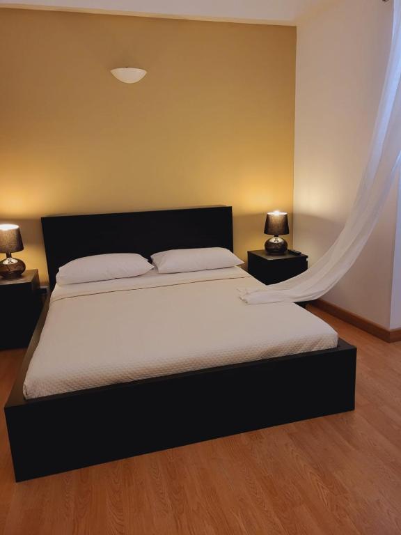 Postel nebo postele na pokoji v ubytování La Perla Di Noto