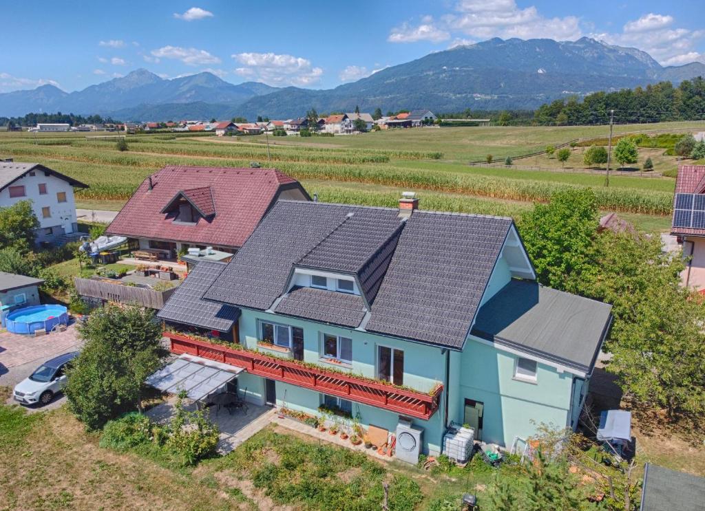 an aerial view of a house with solar panels on its roof at ITSOFT smart apartment in Komenda