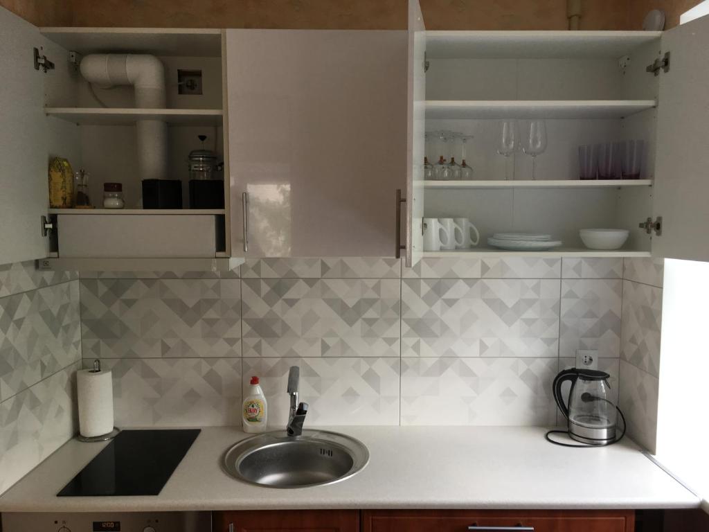 a kitchen with a sink and a counter top at Apartment near the seaside in Jūrmala