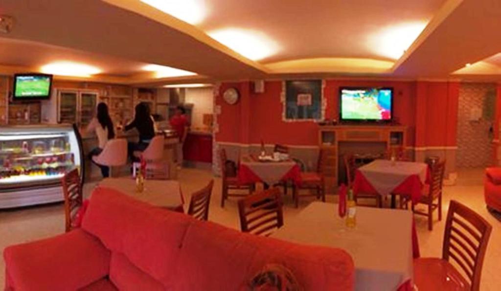 TV a/nebo společenská místnost v ubytování Hotel Cuellar