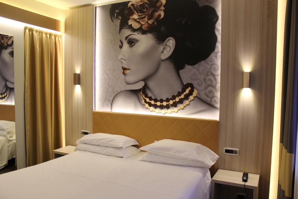 Postel nebo postele na pokoji v ubytování Hotel Camelia