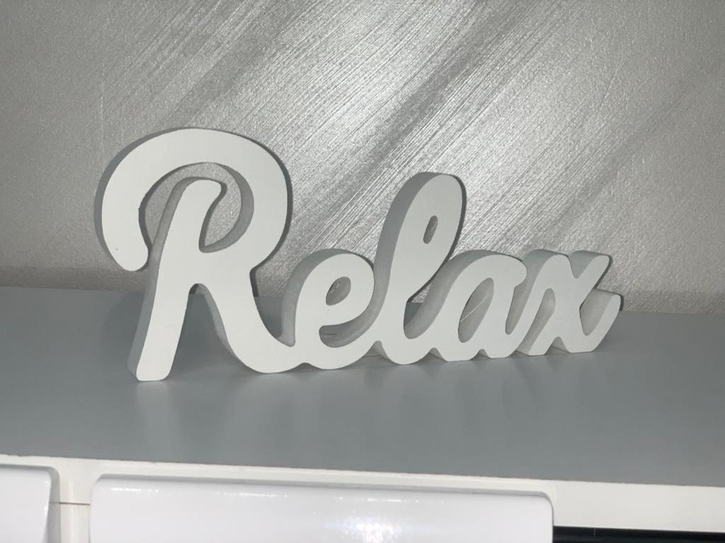 a sign that says razman on top of a laptop at Central Alexa Apartament in Bacău