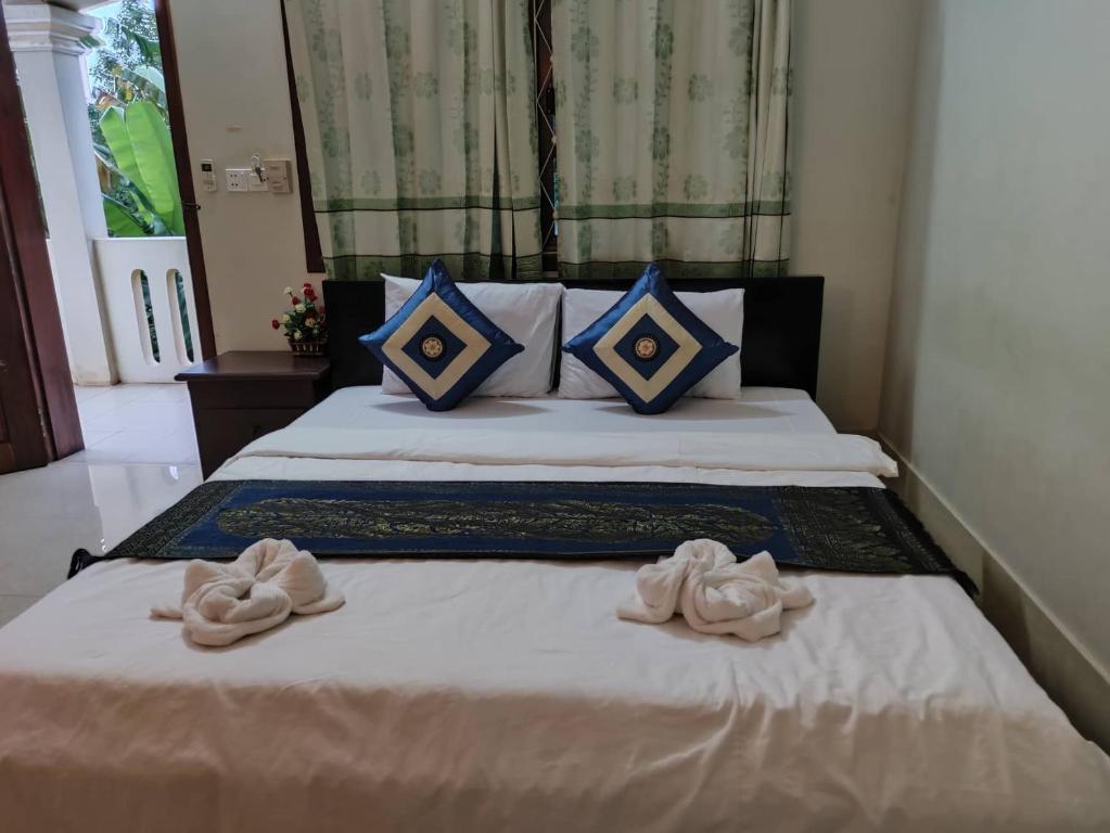 Postel nebo postele na pokoji v ubytování IKI IKI Guesthouse
