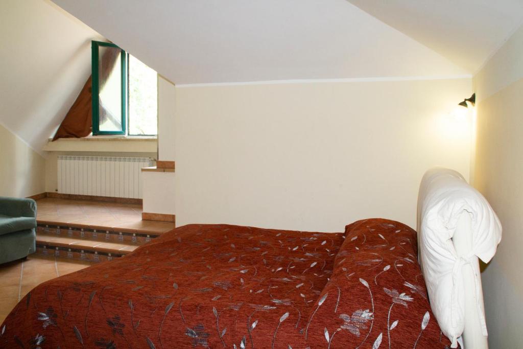 Łóżko lub łóżka w pokoju w obiekcie Casa Tronola
