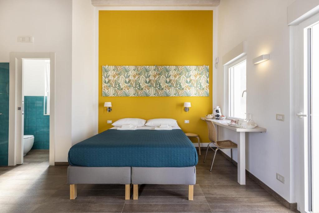 Postel nebo postele na pokoji v ubytování I Gelsomini Guest House