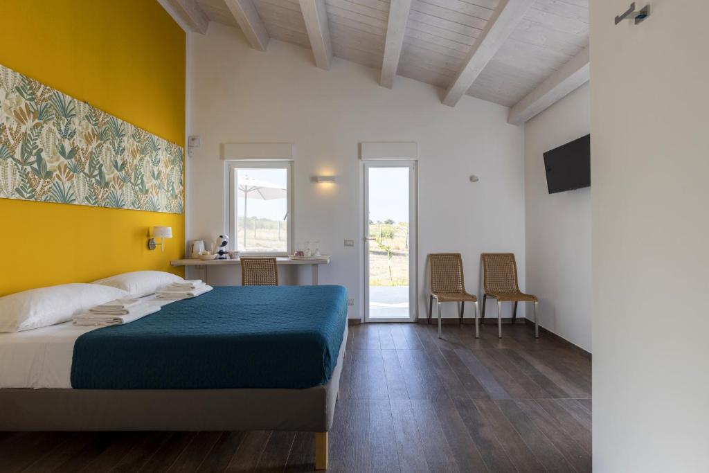 Postel nebo postele na pokoji v ubytování I Gelsomini Guest House