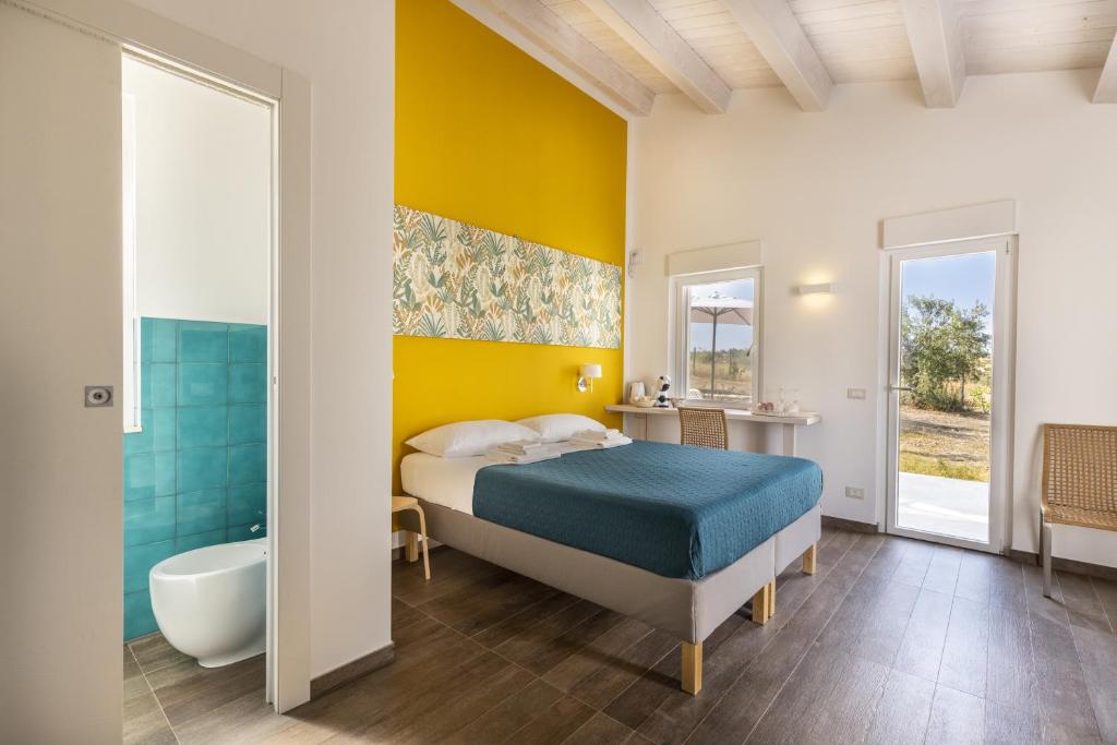 Postel nebo postele na pokoji v ubytování I Gelsomini Guest House