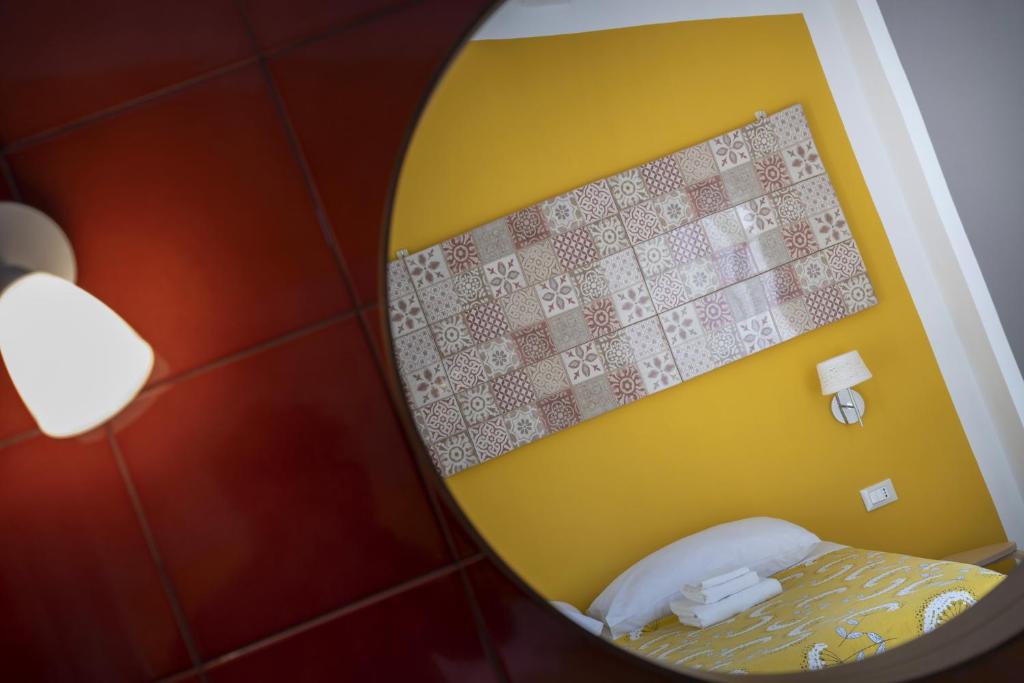 Postel nebo postele na pokoji v ubytování I Gelsomini Guest House
