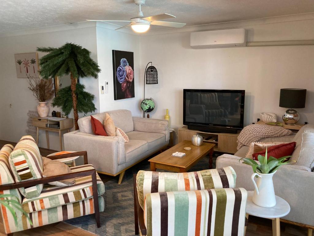 a living room with couches and a flat screen tv at 1166 on Booner - Hawks Nest in Hawks Nest