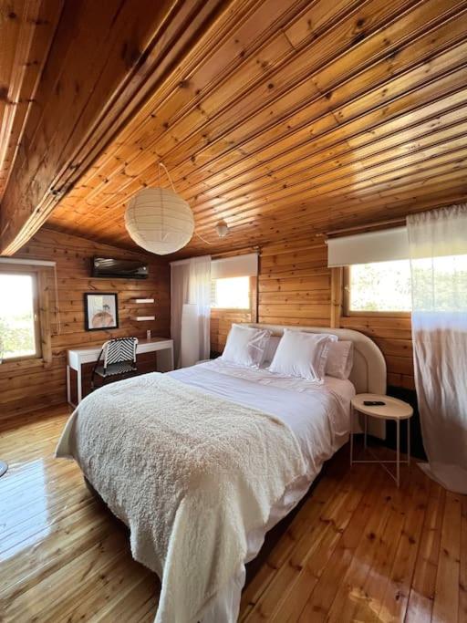 A bed or beds in a room at La Amapola