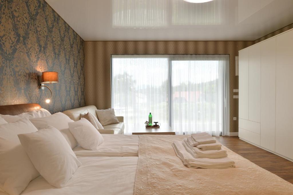 Una cama o camas en una habitación de TI Hotel