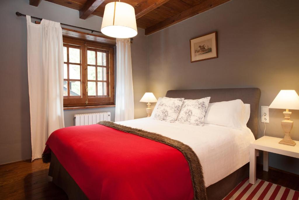 Postel nebo postele na pokoji v ubytování Tarter Chalets Apartaments