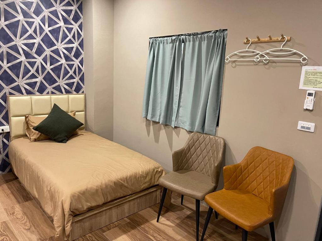 Postel nebo postele na pokoji v ubytování 鄉間小路 Home 備有專屬停車場
