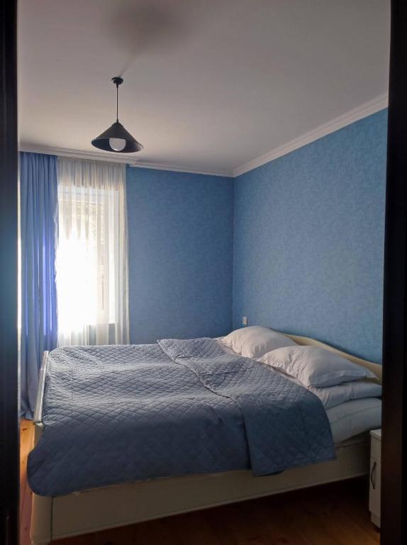 Postel nebo postele na pokoji v ubytování House in Gergeti