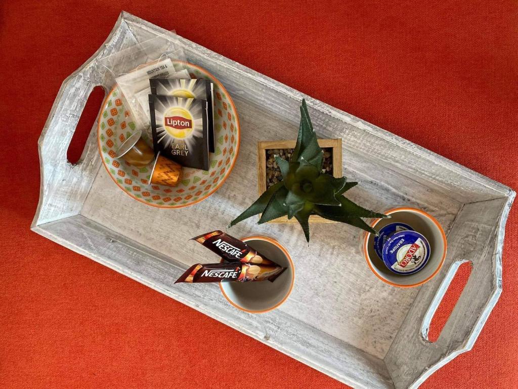 a tray with a drink and a christmas ornament at Ammos 1 in Panteli