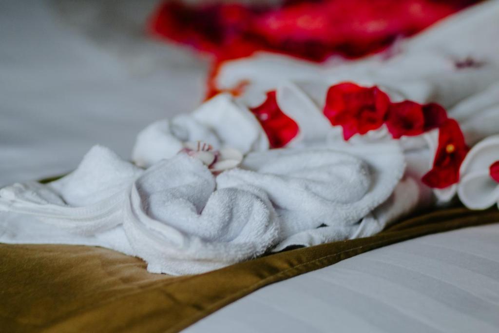 Postel nebo postele na pokoji v ubytování Kurnia Guest House & Spa