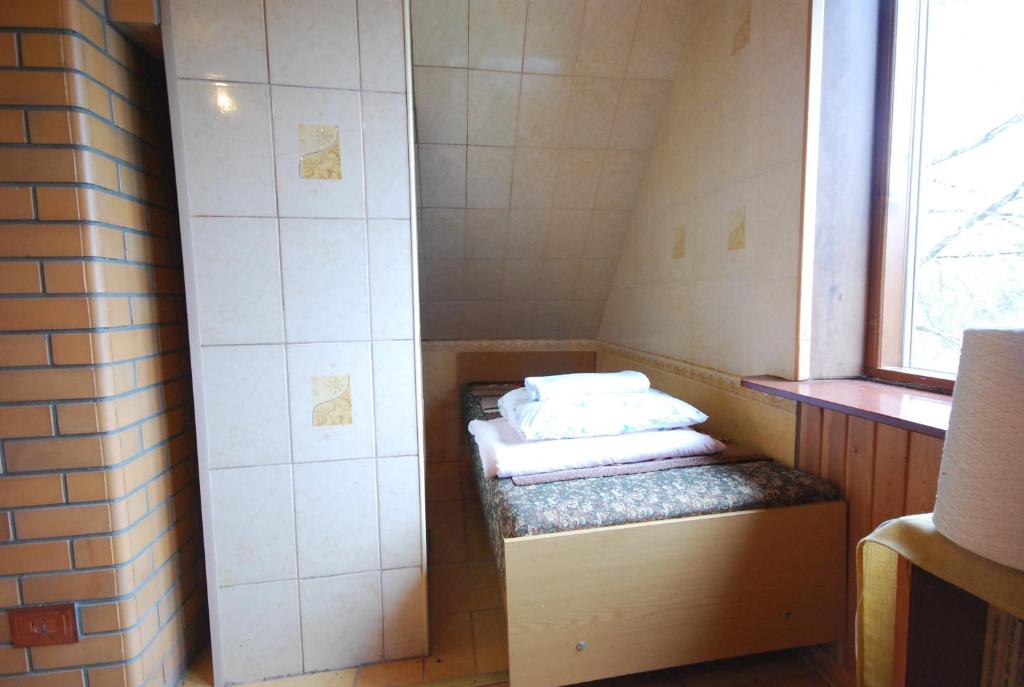 Postel nebo postele na pokoji v ubytování Paide Homestay