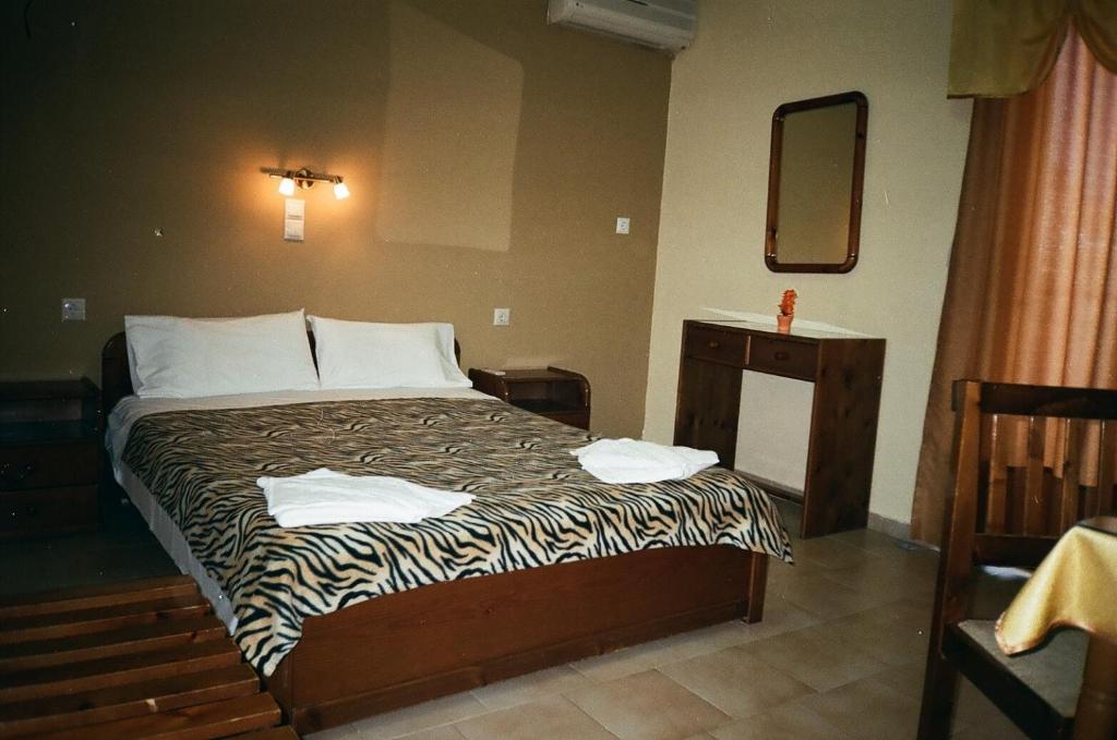 Postel nebo postele na pokoji v ubytování John Apartments