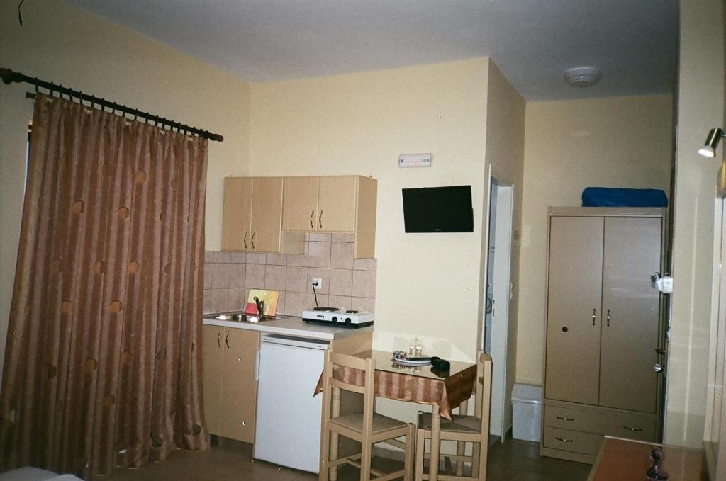 Kuchyň nebo kuchyňský kout v ubytování John Apartments