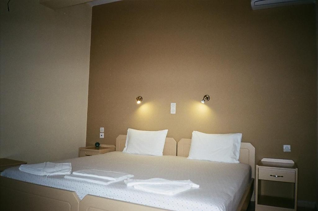 Postel nebo postele na pokoji v ubytování John Apartments