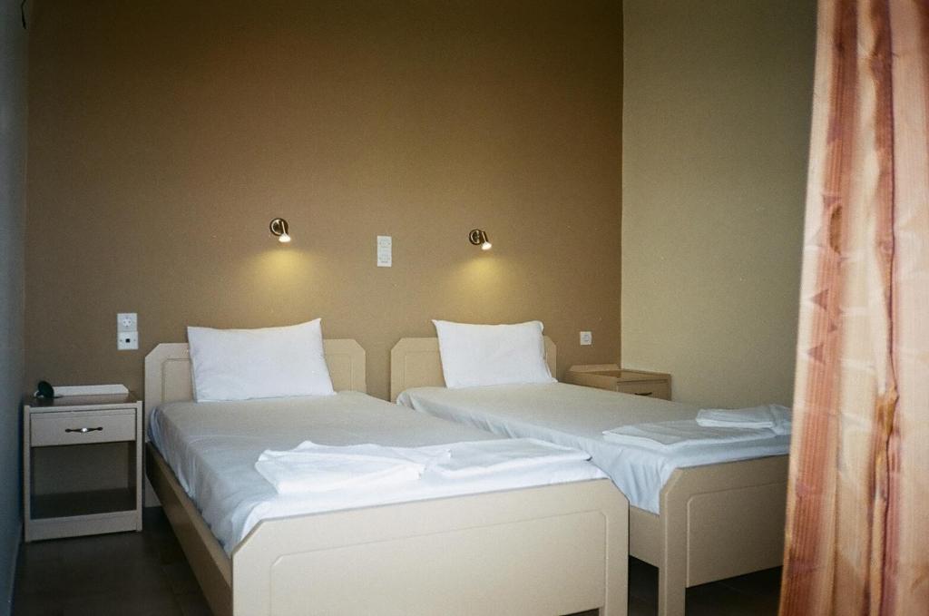 Postel nebo postele na pokoji v ubytování John Apartments