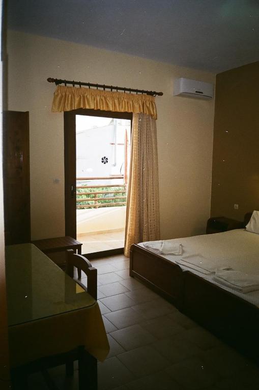 Postel nebo postele na pokoji v ubytování John Apartments
