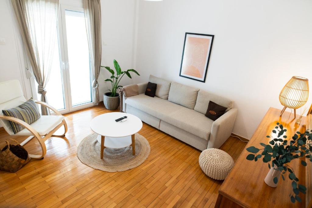 a living room with a couch and a table at Flat 126 in Alexandroupoli