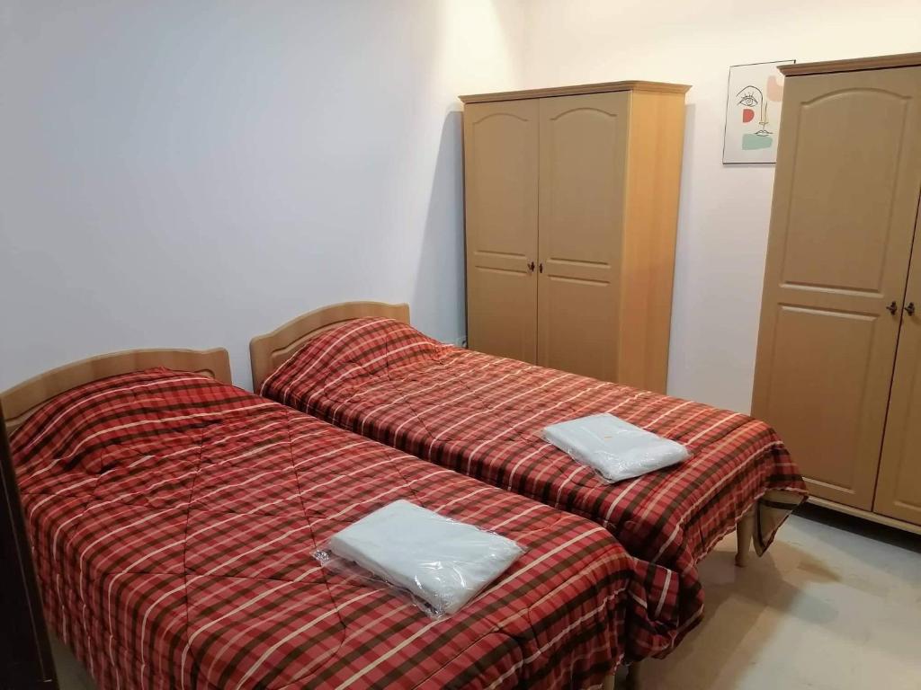 Postel nebo postele na pokoji v ubytování Zayatine C7
