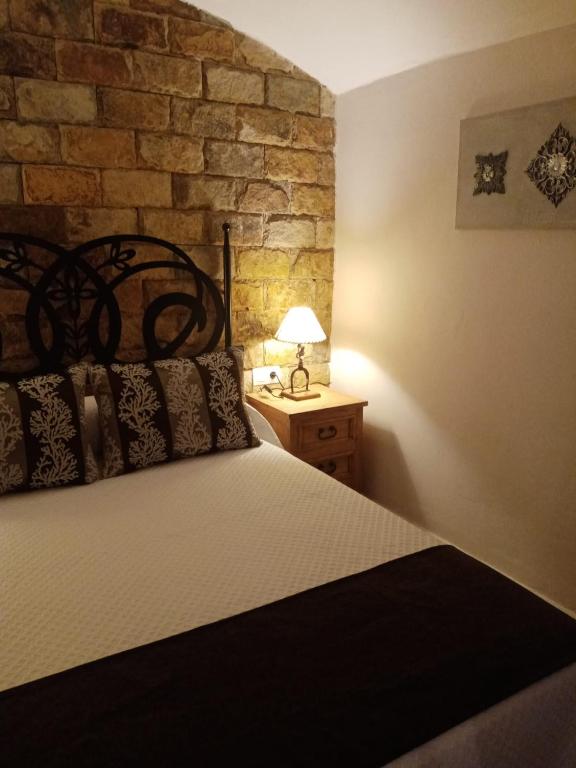 Postel nebo postele na pokoji v ubytování Casa Cueva Soledad