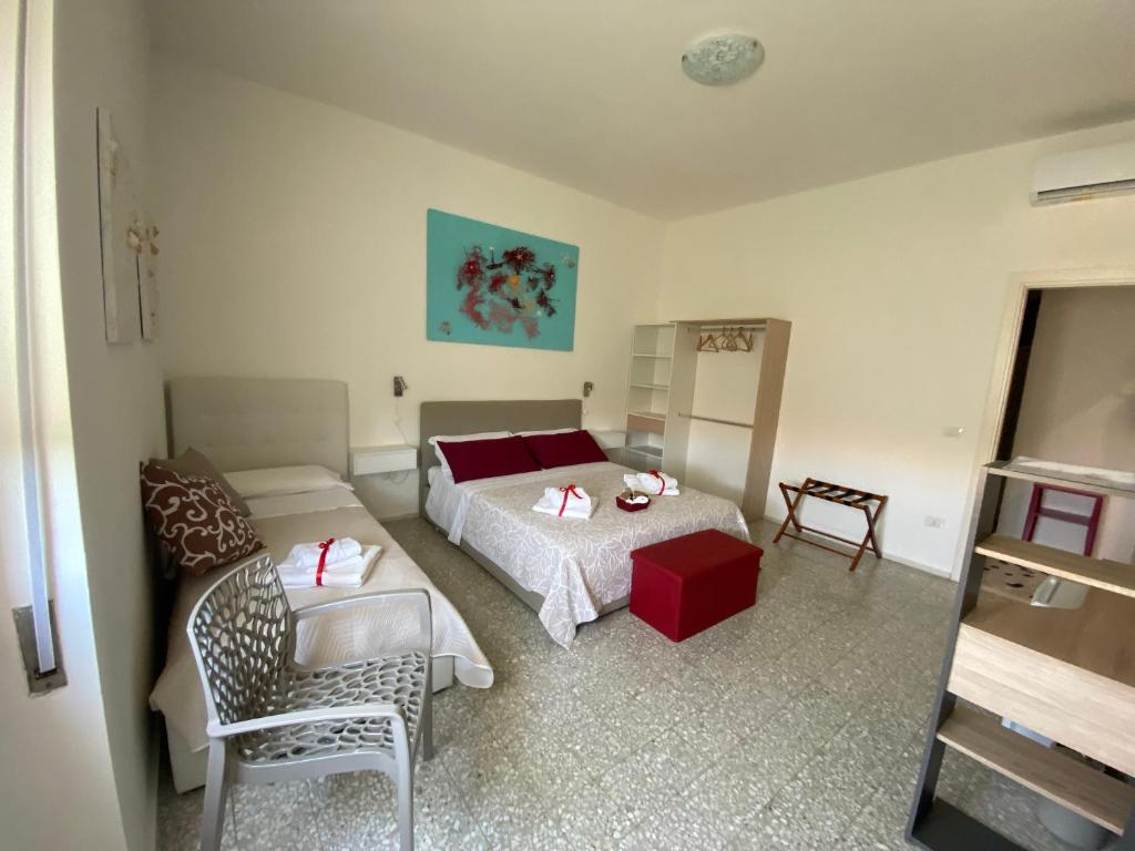 Postel nebo postele na pokoji v ubytování Rossocorallo Rooms