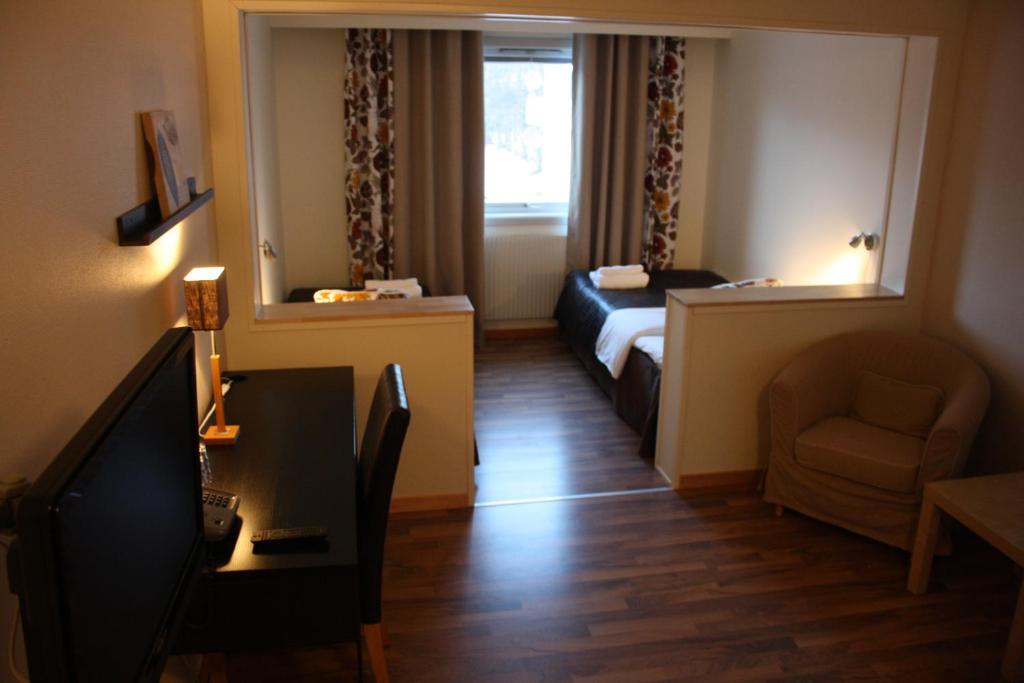 TV a/nebo společenská místnost v ubytování Hotell Lyktan