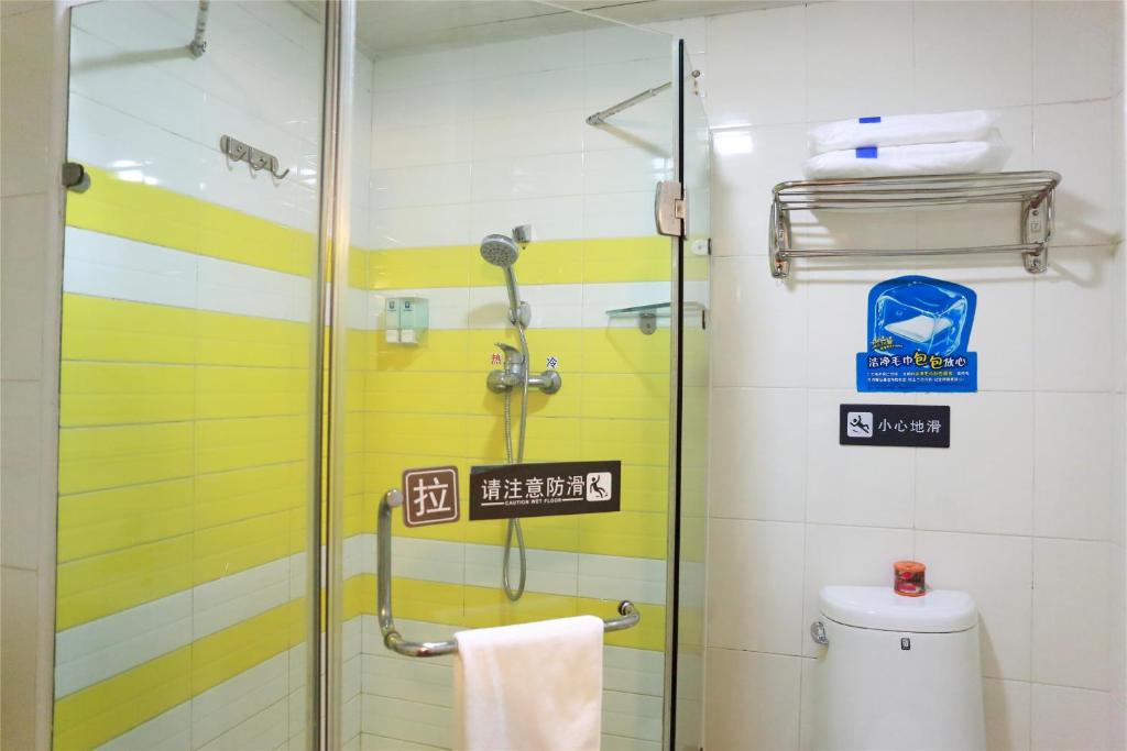 a bathroom with a shower and a toilet at 7Days Inn Xi'an Changying Road in Xi'an