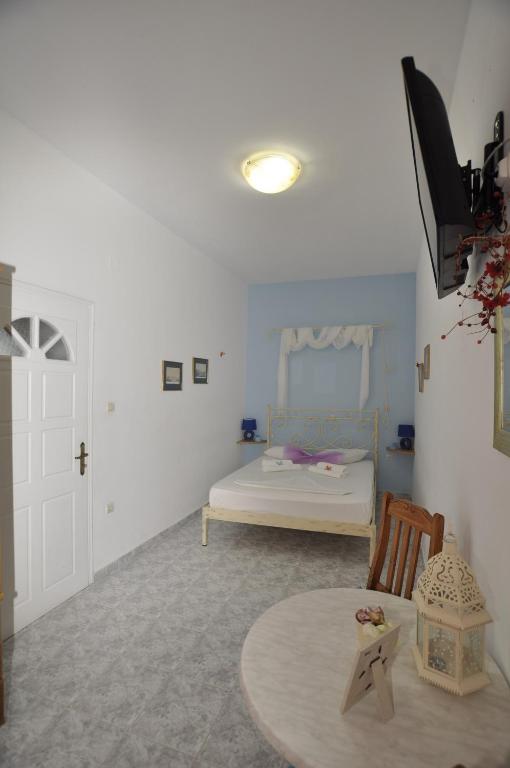 Posteľ alebo postele v izbe v ubytovaní Manos Apartments