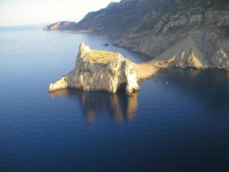 an island in the middle of a body of water at Il Gabbiano blu - Monolocale Blu in Marettimo