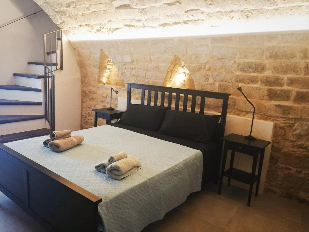 Postel nebo postele na pokoji v ubytování Ibla Barocca