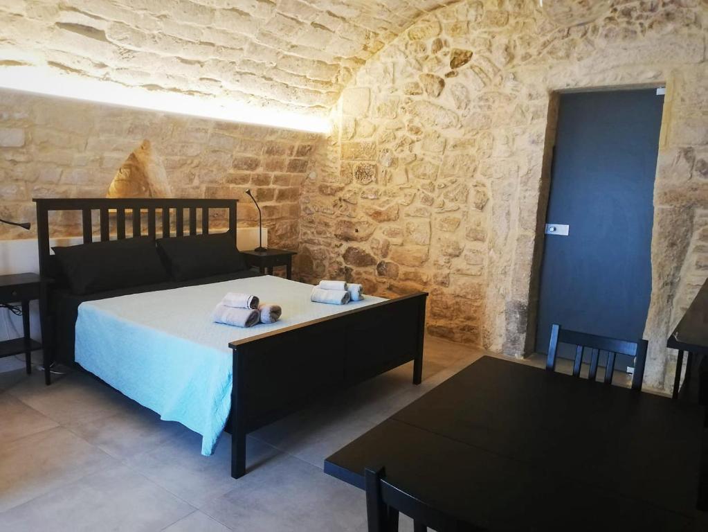 Postel nebo postele na pokoji v ubytování Ibla Barocca