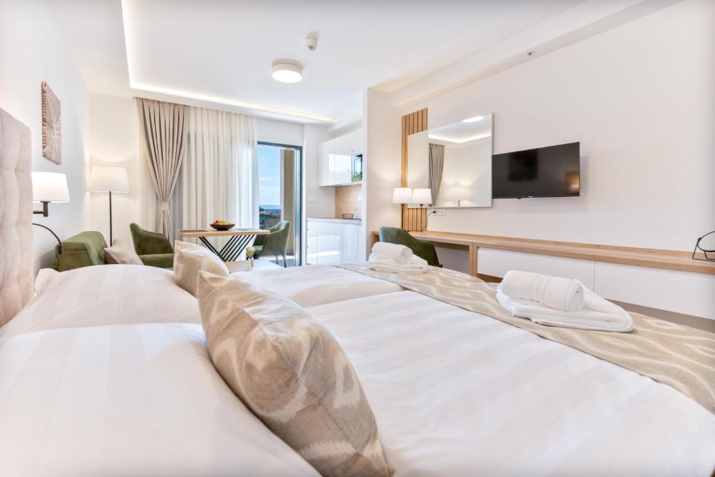 Postel nebo postele na pokoji v ubytování Aparthotel Remaneo