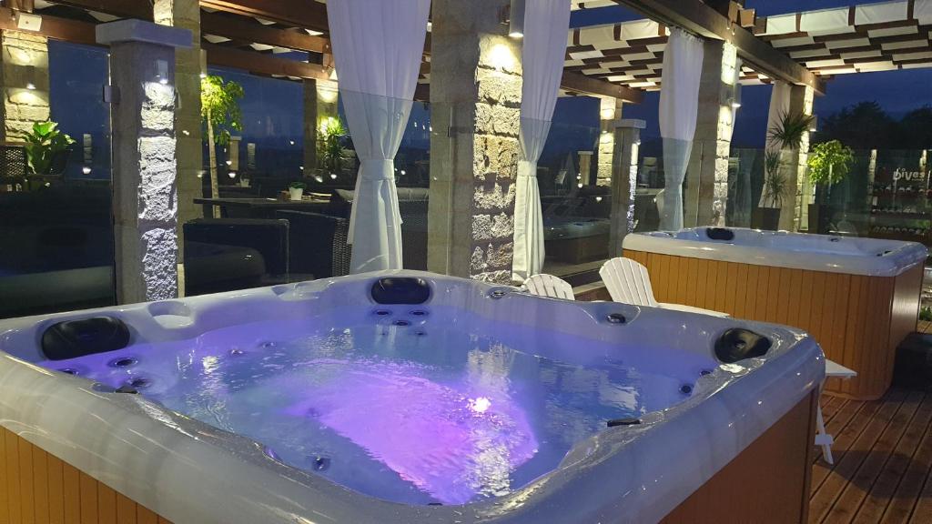 a jacuzzi tub on top of a building at Family Hotel Eterno in Tsigov Chark