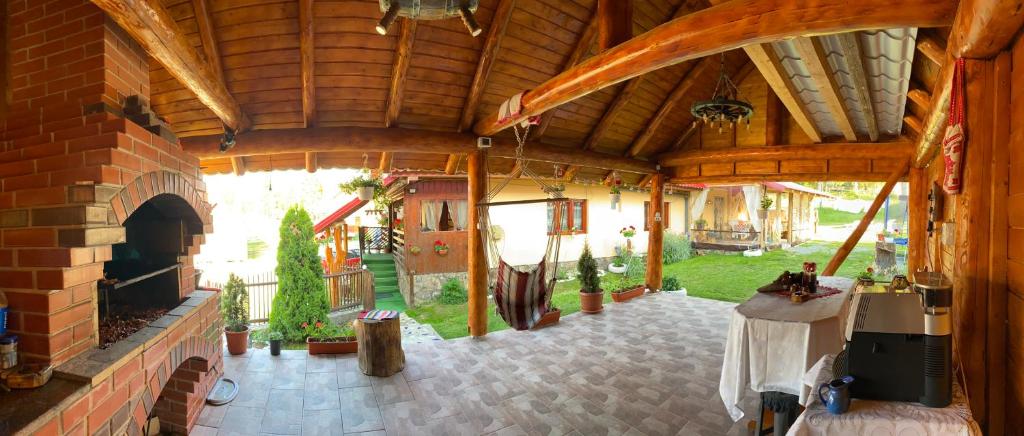 an inside view of a house with a fireplace at Cabana Ancuța in Vartop