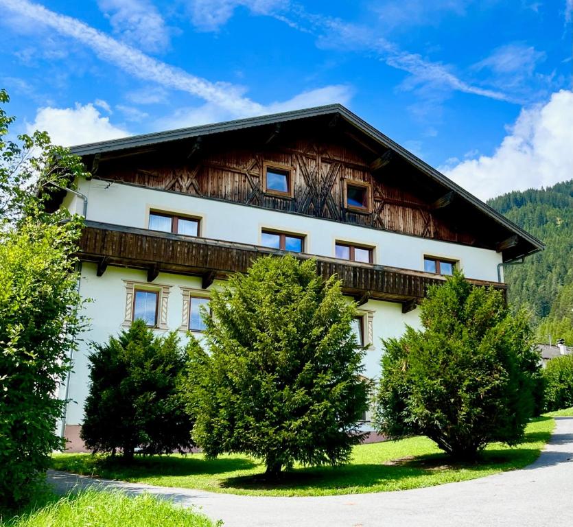 a large white building with trees in front of it at Pranger Hof in Trins